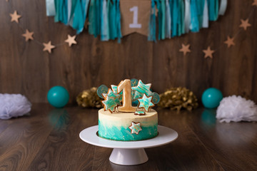 One year old's birthday cake in turquoise colour