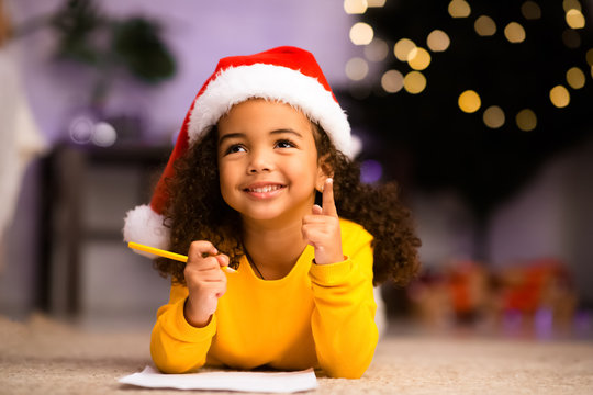 Excited black little girl got idea about Christmas gift