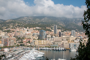Marina and city of Monaco in front of the mountain in the background