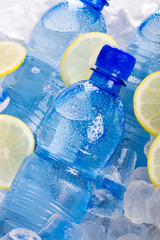 Bottles of mineral water with slices of lemon