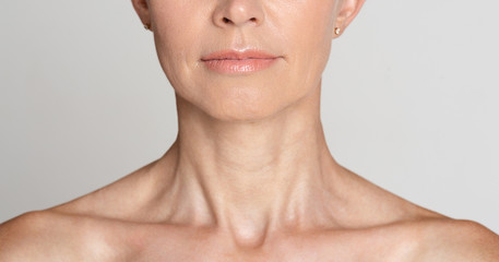 Skin care. Half face portrait of mature woman
