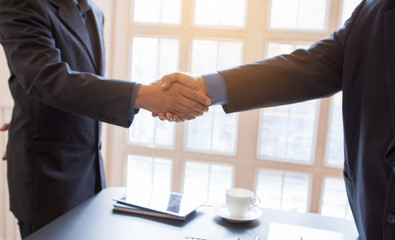 Business people shake hands after reaching a trade agreement and business cooperation.