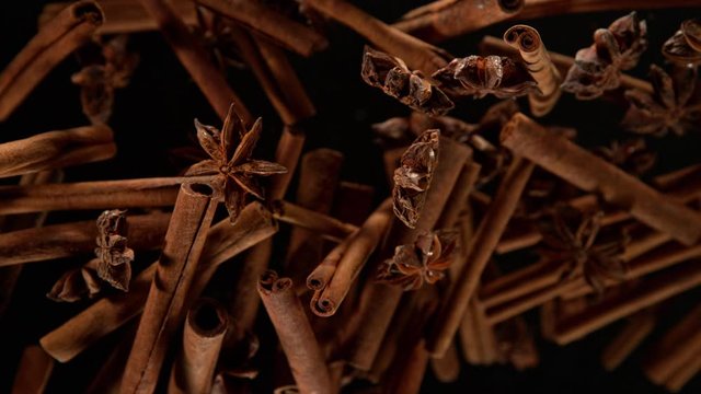 Super Slow Motion Shot of Cinnamon and Star Anise Explosion on Black Background at 1000fps.