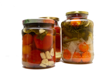 Fototapeta na wymiar Homemade canned food in glass jars on a white background. Pickled organic food.