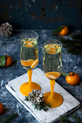 Champagne with tangerines for the New Year's table.