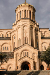 Tbilisi, Georgia Pedestrians walking around the Holy Trinity Cathedral of Tbilisi