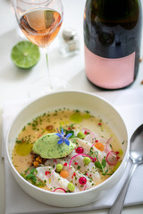 Fine dining, cod ceviche with cucumber and lime sorbet on a bright white background