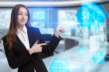 Business, Technology, Internet and network concept. Young businessman working on a virtual screen of the future and sees the inscription: SME