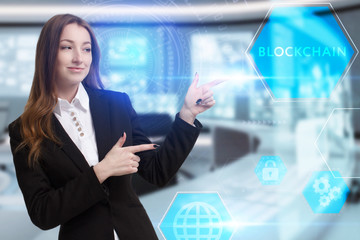 Business, Technology, Internet and network concept. Young businessman working on a virtual screen of the future and sees the inscription: Blockchain