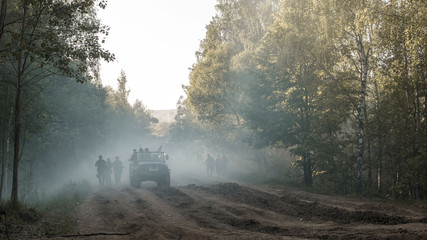 soldiers and smoke in the forest