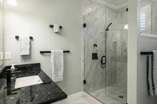 Simple luxury bathroom with granite and marble in residential home or hotel.