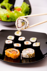 Japanese sushi on a black plate