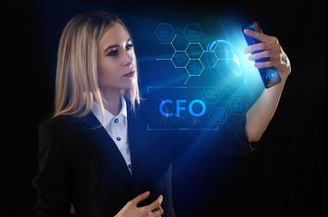 Business, Technology, Internet and network concept. Young businessman working on a virtual screen of the future and sees the inscription: CFO