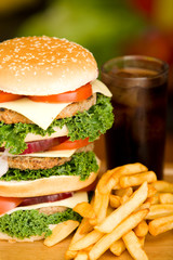 Huge hamburger with french fries