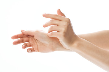 woman applying cream on her hand