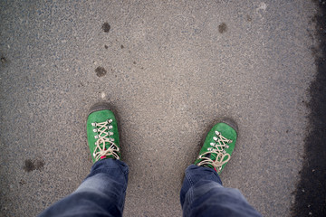 legs with green shoes