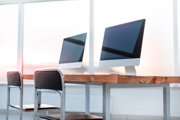 close up. modern computers on a wooden table