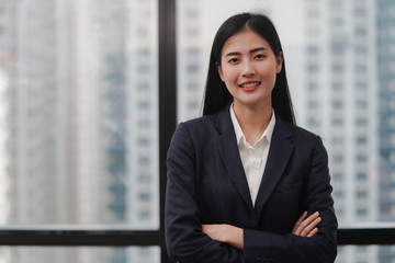 Asian business woman in the office with copy space - Powered by Adobe