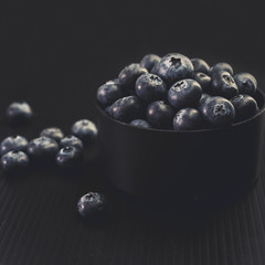 blueberries on black background