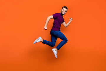Side profile full length body size photo of crazy cheerful jumping running man in white sneakers aspiring to come for sales on time isolated vivid color background