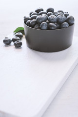 blueberries on wood white background