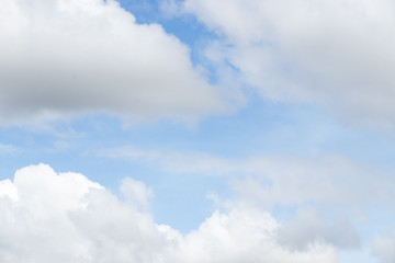 Clear blue sky with white cloud background