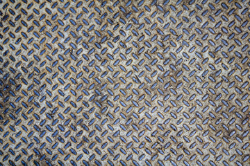 old white rusty metal plate with blue diagonal relief. rough surface texture