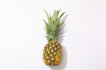 Pineapple on white background, space for text. Juicy fruit