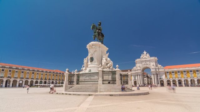 Commerce Square (Praca do Comercio) timelapse hyperlapse in Lisbon, Portugal. Terreiro do Paco, has a statue of of King Jose I in foreground with the arch linking the square with Augusta Street in the