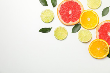 Flat lay with exotic fruits on white background, space for text