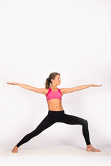 Obraz premium Girl practicing yoga poses, yoga female instructor. Isolated on white, indoor photo