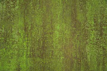 The old stripped green metal surface with rust stains and scratches. Abstract background, texture.