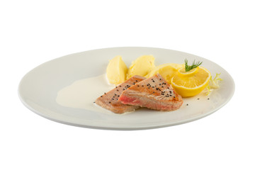 fish tuna with mashed potato and lemon