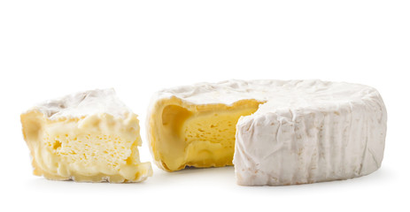 Cheese with white mold and a piece, on a white background. Isolated
