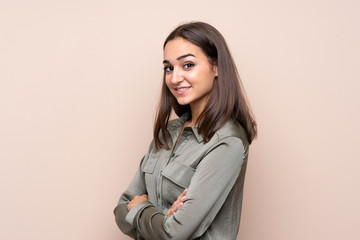 Fototapeta premium Young girl over isolated background with arms crossed and looking forward