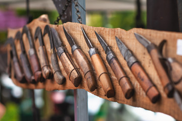 Old knives with wooden handle on display
