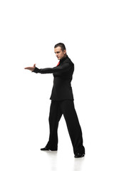 expressive tango dancer in elegant black suit inviting to dance on white background