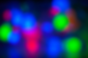 Red, green, pink, blue, blurry christmas and holiday lights. Multicolored, bright blurred background