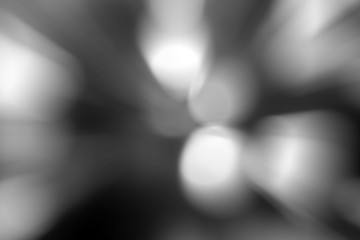 Blurred lights dark gray background. Abstract soft explosion effect. Centric motion pattern