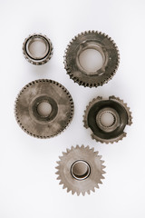 top view of metal round gears on white background
