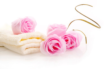 White face towels and pink soap roses