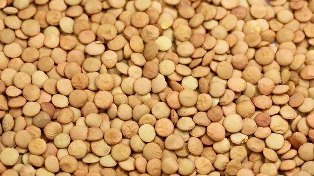 Lentil groats in a circular motion. close up 