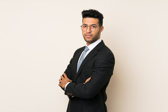 Young handsome businessman man over isolated background