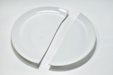 white broken plate on white background.