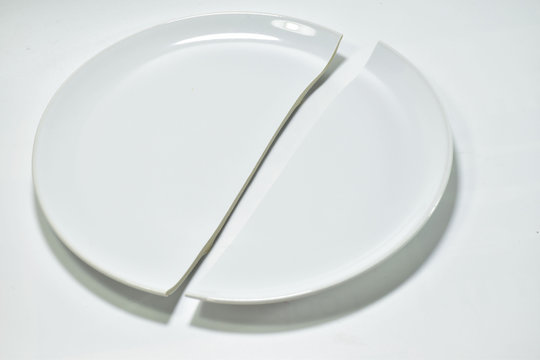 White Broken Plate On White Background.