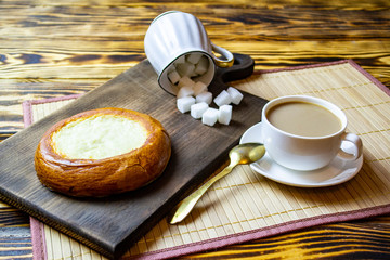morning coffee breakfast with bun, top view