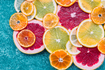 Slices of mandarin, orange, grapefruit and lemon very close-up, macro