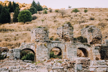 Antique city Ephesus. The ruins of an ancient city in Turkey. Selcuk, Kusadasi, Turkey. Archaeological excavations. Old barillefs. Ruined statues.