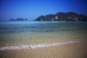 Blue sea on a background of mountains. Thailand.