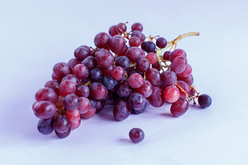 Grapes on a light purple background